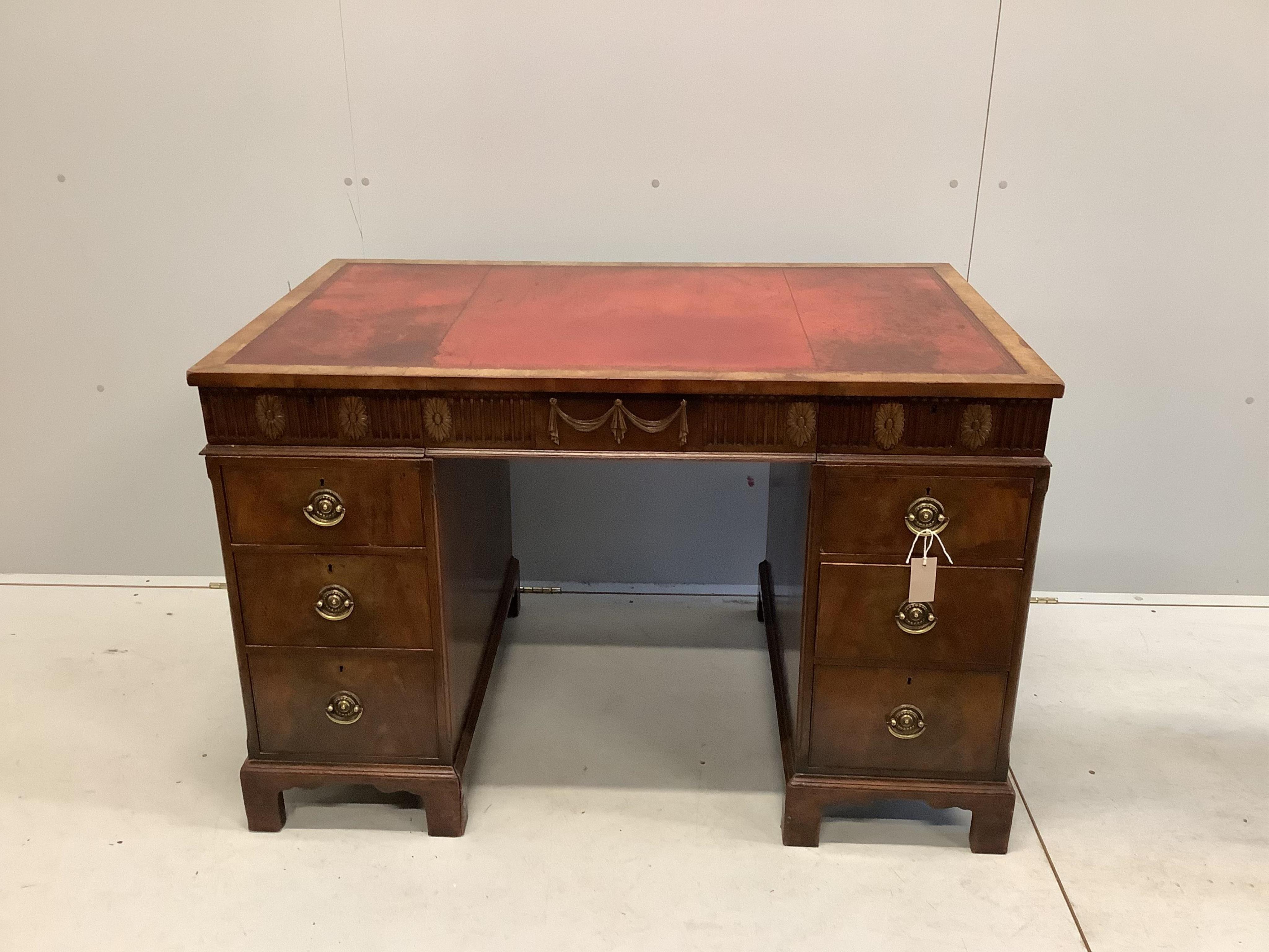 An early Georgian style walnut pedestal desk with inset leather top, width 117cm, depth 71cm, height 77cm. Condition - fair to good